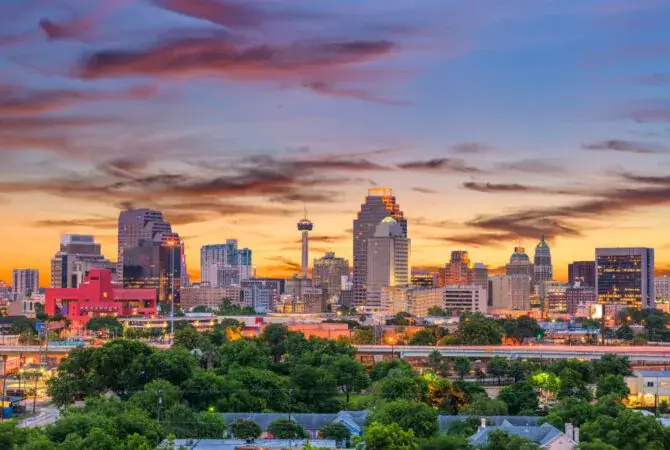San Antonio skyline at sunset representing professionals seeking private rehab and recovery beyond the city
