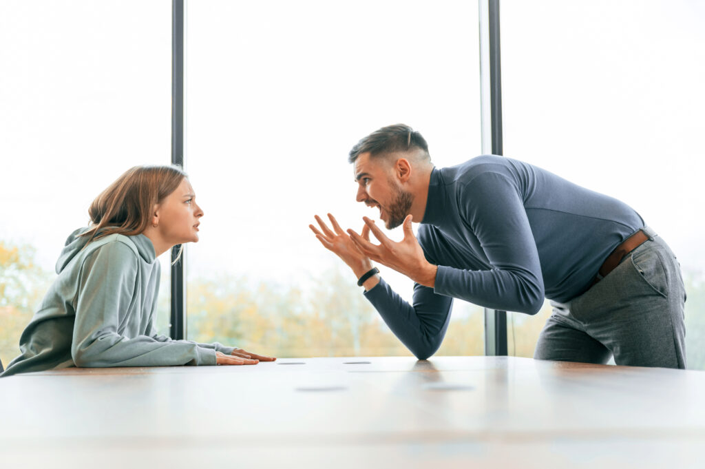 A tense conversation showing emotional conflict and why people avoid rehab for addiction treatment